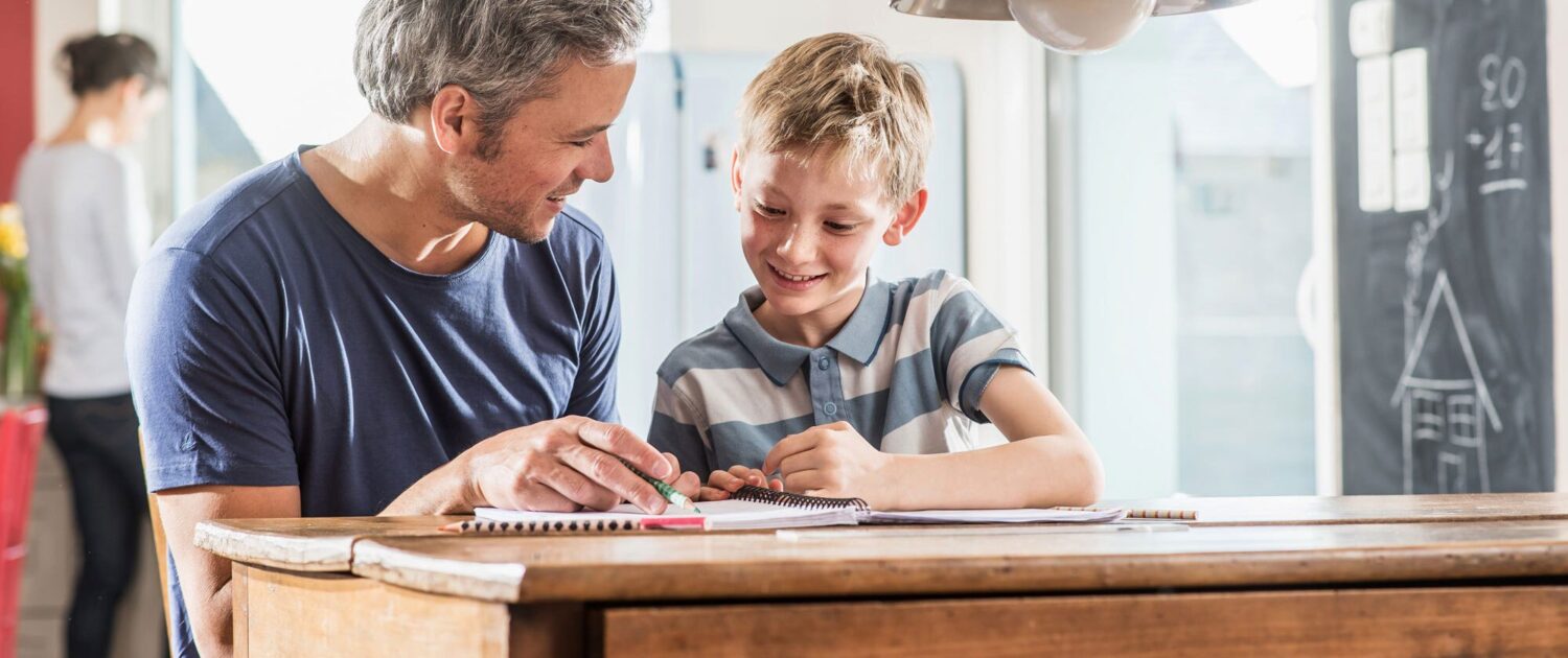 dad helping his son with homework